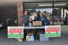 Collecting donations from patrons at Fosters Supermarket