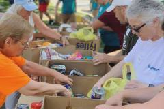 Volunteers packing food donations