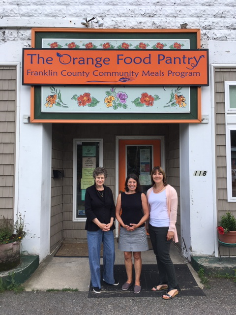 Orange Food Pantry with staff standing outside