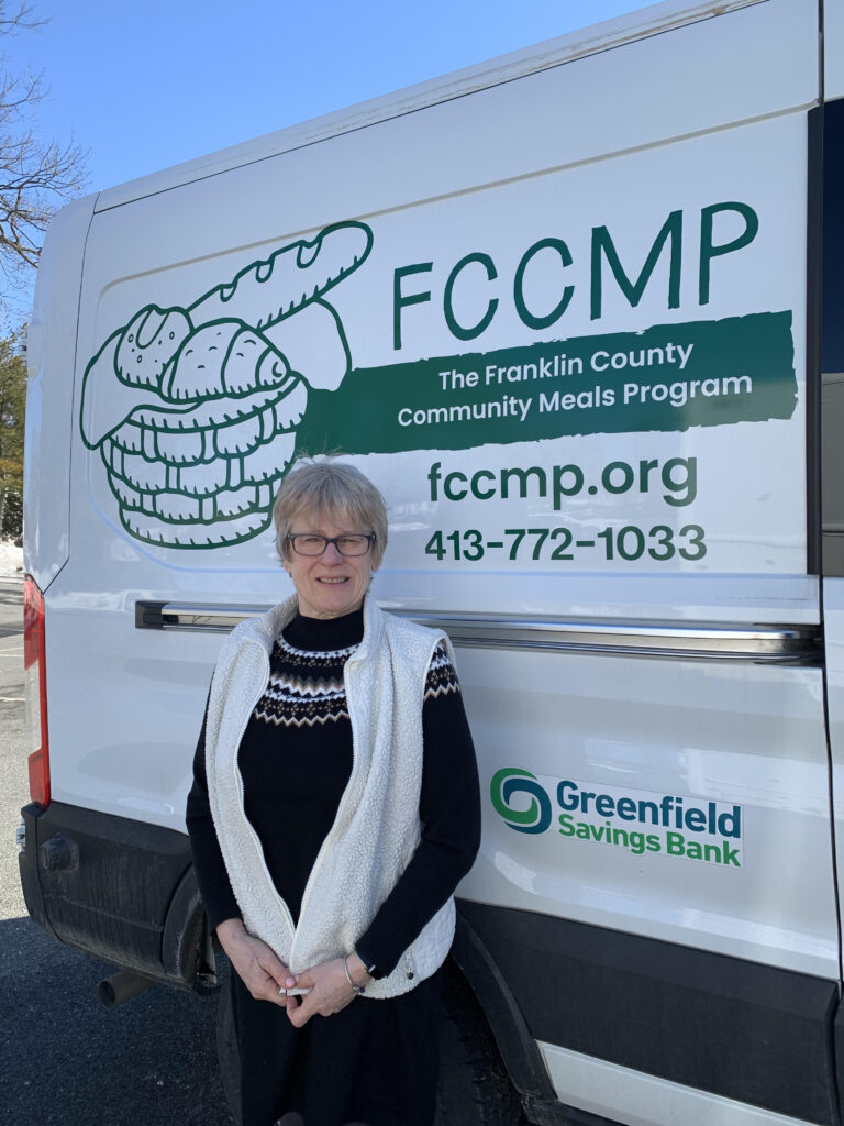 Kim Croce standing in front of FCCMP van